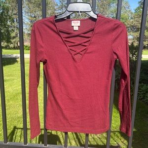 Neck top with criss cross pattern through neckline